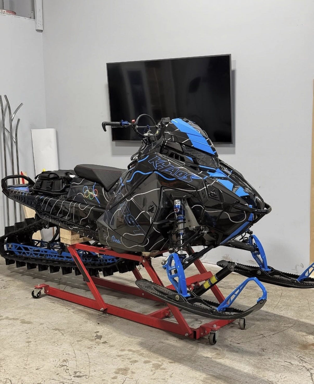 Black and blue custom snowmobile wrap