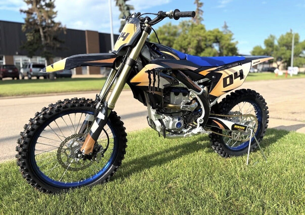 Custom black orange and blue dirt bike graphics