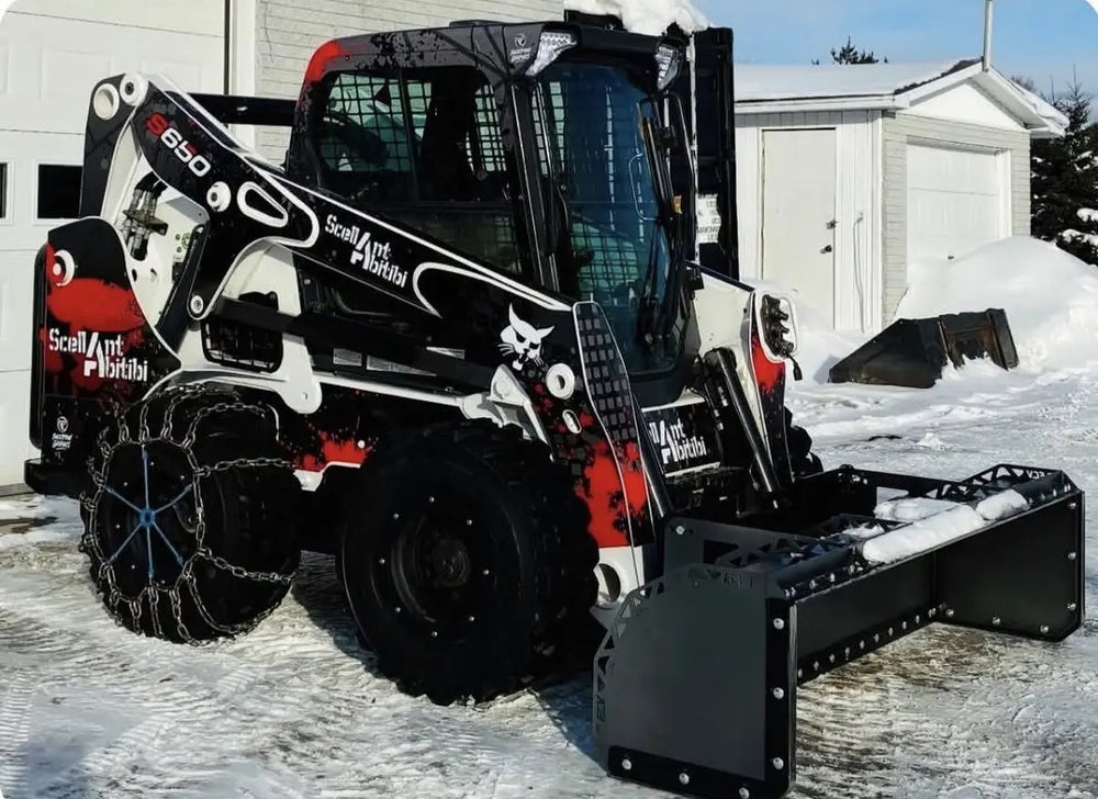 Red and black Bobcat graphics photographed in the snow