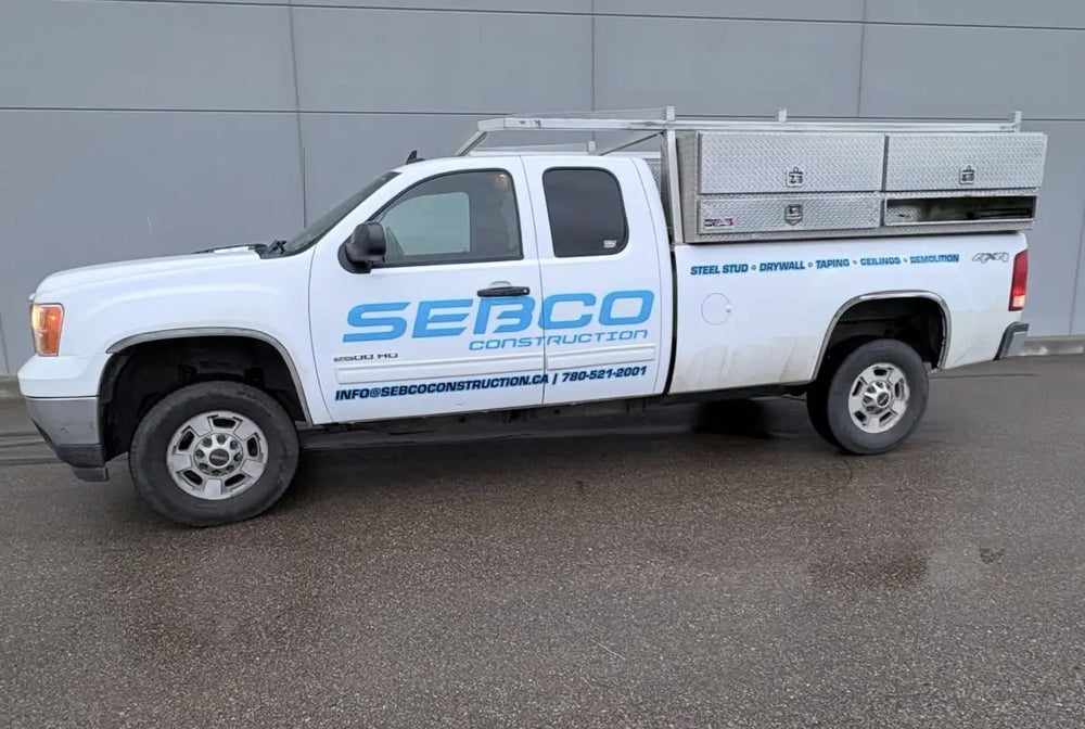 White work truck with blue SEBCO fleet lettering