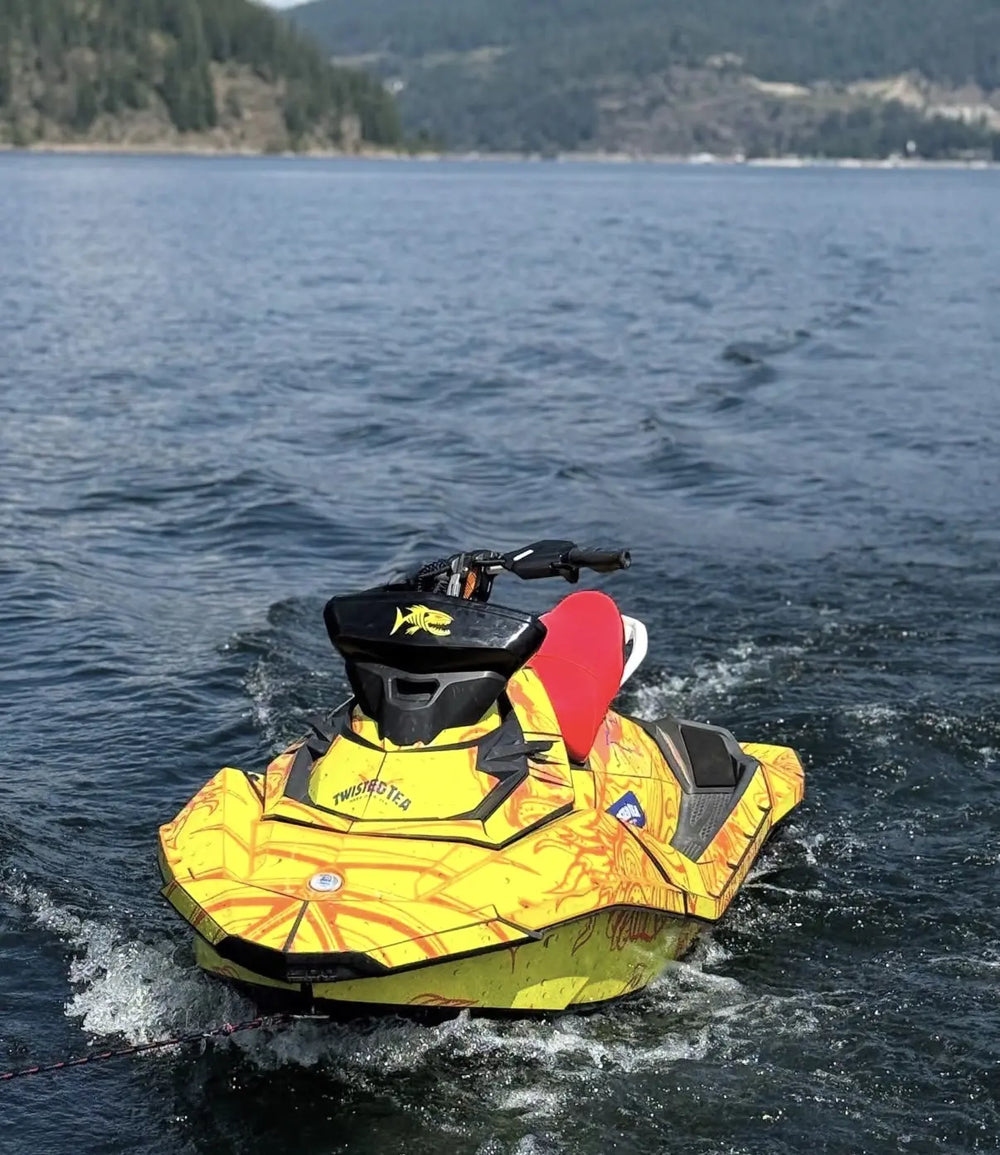 Yellow wrapped watercraft on a lake